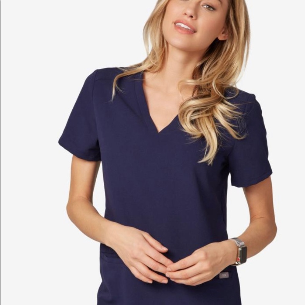 Figs Casma 3 pocket scrub top in navy blue.